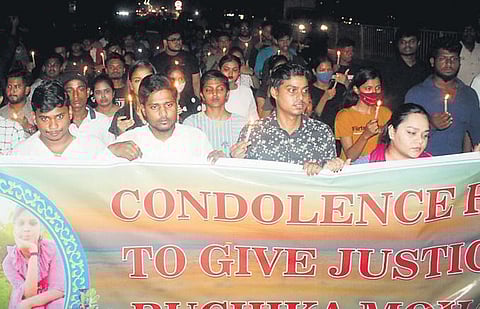 Students of BJB College take out a candle rally in Bhubaneswar on Sunday | Express