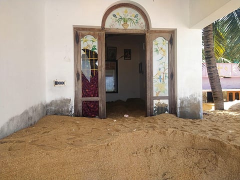 Heaps of sand have seeped into houses following sea water intrusion at Azhickal area in Kanniyakumari district | Express