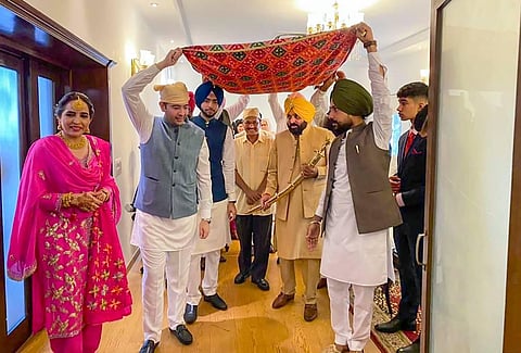 Punjab CM Bhagwant Mann during his wedding ceremony in Chandigarh. AAP leaders Arvind Kejriwal and Raghav Chadha are also seen. (Photo | PTI)