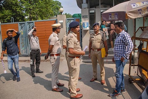Chhattisgarh Police personnel give a notice to the local police in the Sector 20 Police Station regarding the arrest of Zee News anchor Rohit Ranjan, in Noida. (Photo | PTI)