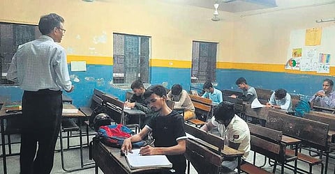 A special coaching session being held for CUET aspirants at the Government Boys Senior Secondary School in Shahdara. (Photo | Express)