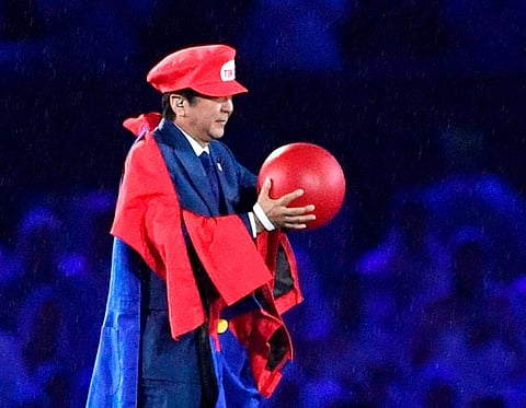 Then Japanese Prime Minister Shinzo Abe appears as the Nintendo game character Super Mario. (Photo | AP)