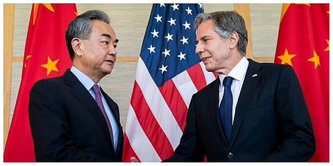 US Secretary of State Antony Blinken, right, shakes hands with China's Foreign Minister Wang Yi during a meeting in Nusa Dua. (Photo | AP)