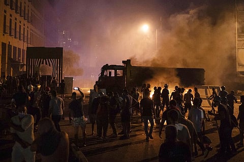 Demonstrators clash with police during a protest against the political elites and the government after the deadly explosion at Beirut port in August 2020. (Photo | AP)