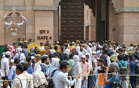In this file photo security personnel stand guard as Muslims arrive in a large number at the Gyanvapi mosque to offer Friday prayers, in Varanasi, Friday, May 20, 2022. (Photo | PTI)