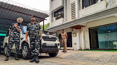 Security personnel stand guard at the residence of Shiv Sena MP Sanjay Raut during a raid by by ED officials, in Mumbai. (Photo | PTI)