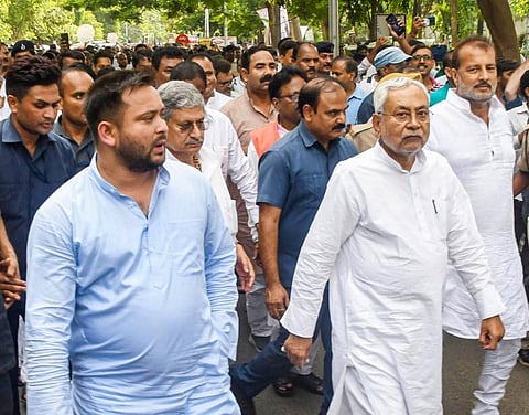 Janata Dal (United) leader Nitish Kumar with JDU National President Lalan Singh and Rashtriya Janata Dal leader Tejashwi Yadav, in Patna. (Photo | PTI)