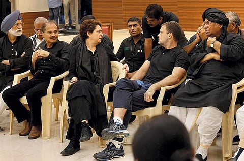 Congress leaders Rahul Gandhi and Priyanka Gandhi with party leaders after being detained by police during a protest over price rise in New Delhi, on August 5, 2022. (File Photo | PTI)