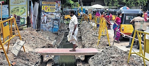 An under-construction stormwater drain on Redhills Road in Villivakkam, Chennai, on Tuesday | P Jawahar