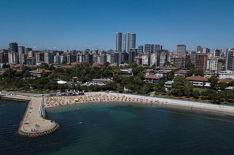 An aerial picture taken on July 28, 2022 shows umbrellas and deckchairs at Caddebostan beach on the Bosphorus coast on the Asian side in Istanbul. (Photo | AFP)