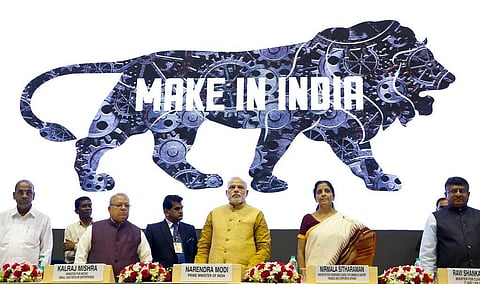Indian Prime Minister Narendra Modi, center, unveils the logo of 'Make in India' initiative in New Delhi, India, Sept. 25, 2014. (File Photo | AP)