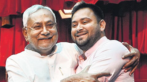 Bihar Chief Minister Nitish Kumar with his deputy Tejashwi Prasad Yadav after their swearing-in ceremony at Raj Bhavan in Patna.