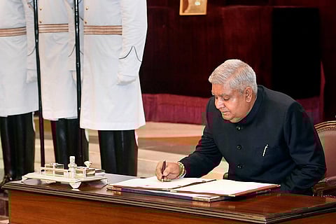 Jagdeep Dhankhar signs a register after taking oath as the 14th Vice President of India, at a ceremony at Rashtrapati Bhavan in New Delhi, Thursday. (Photo | PTI)
