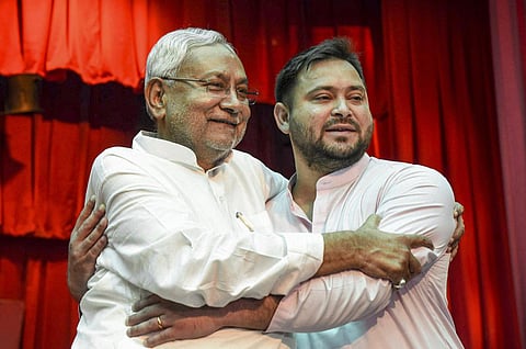Bihar Chief Minister Nitish Kumar with his deputy Tejashwi Yadav during their swearing-in ceremony the at Raj Bhavan in Patna. (Photo | PTI)