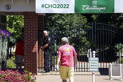 An officer stands outside a gate of the Chautauqua Institution in Chautauqua, N.Y., Friday, Aug. 12, 2022. (Photo | AP)