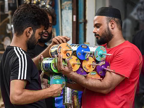 A vendor sells 'manja' for flying kites for the upcoming Independence Day, in Old Delhi, Saturday, Aug. 13, 2022. (Photo | PTI)