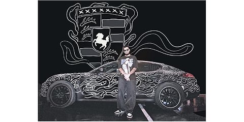 Hazarika with the Porsche Panamera that he doodled on at ‘All You Can Street Festival’