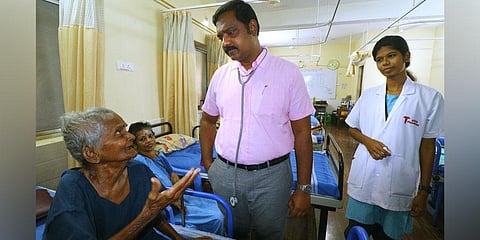 Dr R Balagurusamy with a patient who was deserted by family. (Photo | K K Sundar, EPS)