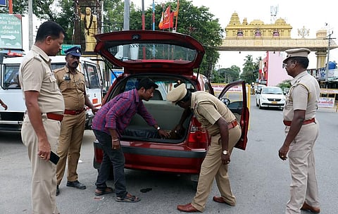 Tamil Nadu police checking vehicles at checkpoints. (Photo | Special Arrangement)