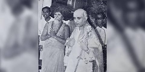 Thiruvaduthurai Aadheenam representative Sri La Sri Kumaraswamy Thambiran presents Pandit Jawaharlal Nehru the golden sceptre on the night of August 14, 1947