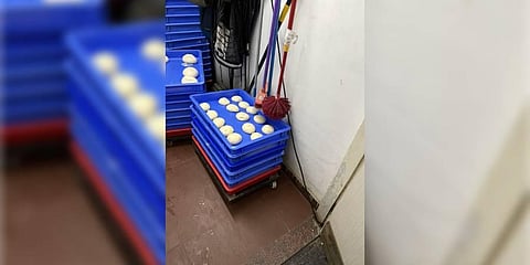 A picture purportedly showing a mop and a toilet brush hanging above the pizza dough almost touching it. (Photo | Twitter)