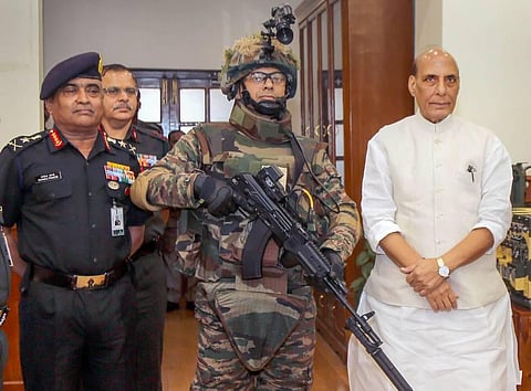 Union Defence Minister Rajnath Singh hands over indigenously-developed Future Infantry Soldier as a System (F-INSAS) to the Indian Army. (Photo | PTI)