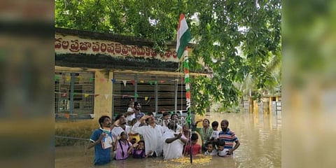 Students and teachers take part in Independence Day celebrations at flood-hit Appanaramunilanka in Sakhinetipalli mandal | Express