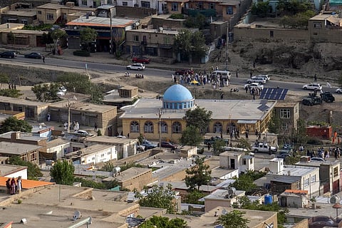 Taliban fighters and local residents gather around a mosque that has been bombed, in Kabul, Afghanistan. (Photo | AP)