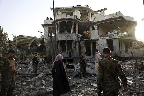 In this image dated March 31, 2022, Afghan security personnel inspect a damaged building in the aftermath of an attack in Kabul, Afghanistan. (File Photo | AP)