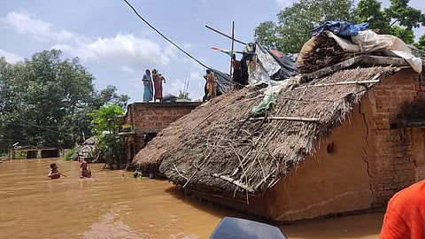 People on rooftop in Bilipada village under Damapada block. (Photo | Express)