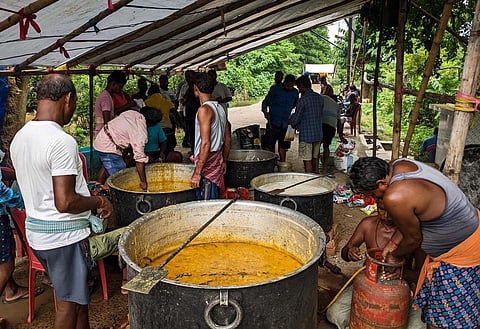 Food is prepared to be distributed in flooded villages at Teramanpur in Jagatsinghpur. (Photo | Debadatta Mallick, EPS)
