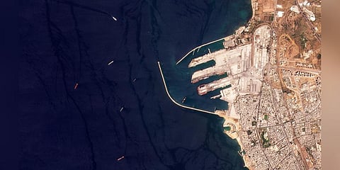 This satellite image from Planet Labs PBC shows the Russian-flagged cargo ship SV Konstantin, the red vessel the furtherest left, off the port in Tartus, Syria.(Photo | AP)