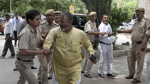 AAP leaders being detained for gathering outside Delhi Deputy Chief Minister Manish Sisodia's residence after CBI raided his premises. (Photo | Shekhar Yadav,EPS)
