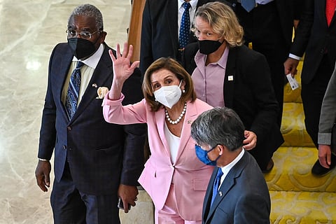 Speaker of the US House of Representatives Nancy Pelosi waving as she leaves the Parliament House after a meeting with Malaysian officials in Kuala Lumpur. (Photo | AFP)