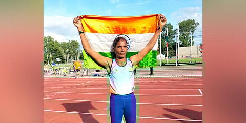 Premila holds up the tri-colour after winning in the Netherlands. (Photo | Express)