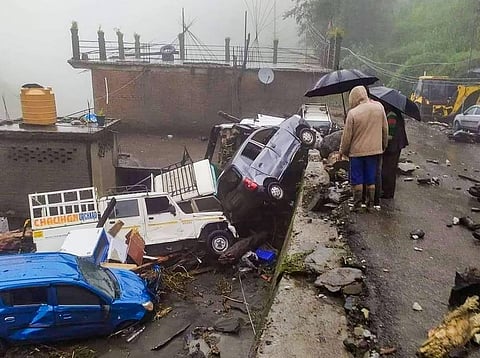Damaged vehicles after being hit by flash flood following heavy monsoon rains, in Mandi, Saturday, Aug. 20, 2022. (Photo | PTI)