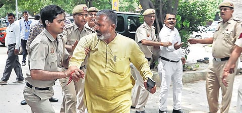 Police detain AAP supporters outside Deputy CM Manish Sisodia’ residence during a CBI raid on Friday (Photo |Shekhar Yadav)