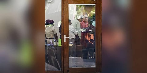 Delhi Deputy Chief Minister of Delhi Manish Sisodia with officials of Central Bureau of Investigation (CBI) during a raid at his residence in connection with alleged irregularities in Delhi Excise Pol