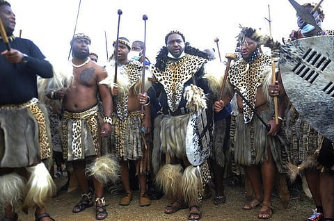 King Misuzulu ka Zwelithini, centre, stands flanked by fellow warriors in traditional dress at the KwaKhangelamankengane Royal Palace, during a ceremony, in Nongoma, South Africa. (File Photo | AP)
