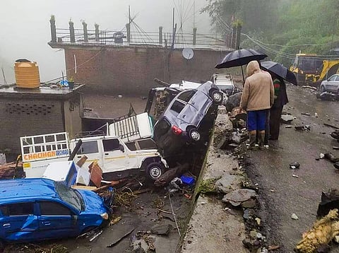 Damaged vehicles after being hit by flash flood following heavy monsoon rains, in Mandi, Himachal Pradesh, on August 21, 2022. (Photo | PTI)