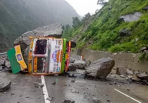 A truck damaged by boulders after landslide triggered by heavy monsoon rains, near Mandi, on August 22, 2022. (Photo | PTI)
