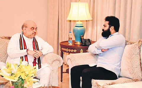 Union Home Minister Amit Shah and Tollywood actor Junior NTR interact at the Novotel Hotel in Hyderabad on Sunday