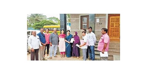 Deputy Commissioner of BDA’s Land Acquisition Cell Dr A Soujanya hands over the entitlement certificate to a land loser at Kalathammanahalli village | Express