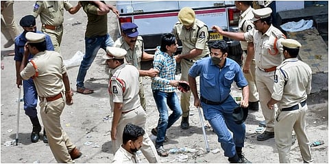 Police detain protesters who were demonstrating against BJP MLA Raja Singh over his remarks on Prophet Mohammad, at Shalibanda in old city of Hyderabad. (Photo | PTI)