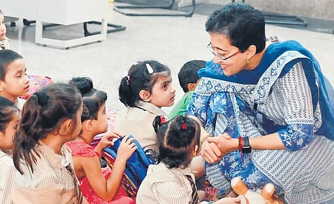 AAP MLA Atishi interacts with students in a government school | express