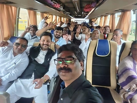 Jharkhand Chief Minister Hemant Soren along with the MLAs from the ruling coalition are seen inside a bus headed to an unknown destination. (Photo | Twitter)