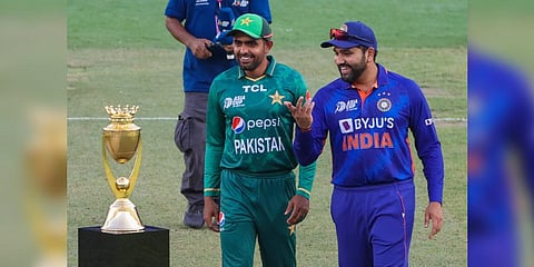 India's captain Rohit Sharma (R) and Pakistan's captain Babar Azam arrive for the toss before start of the Asia Cup Twenty20 international cricket Group A match. (Photo | AFP)