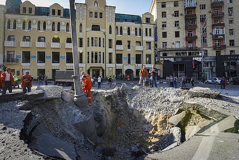 A view of a crater from a night Russian rocket attack, near to damaged buildings in downtown Kharkiv, Ukraine, Saturday, Aug. 27, 2022. (Photo | AP)