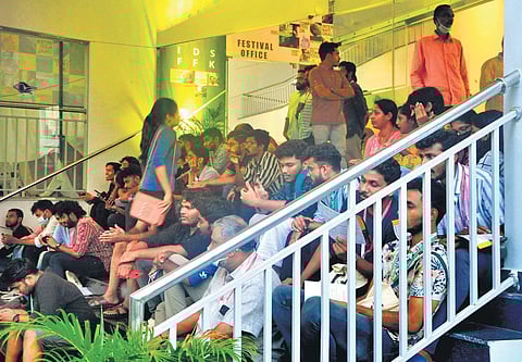 Delegates of the 14th International Documentary and Short Film Festival of Kerala spending their leisure time on the steps of Kairali-Sree-Nila theatre in Thiruvananthapuram, the venue of the festival