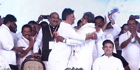 Karnataka Congress chief D K Shivakumar hugs party heavyweight Siddaramaiah at his 75th birthday event on August 3, 2022. (Video screengrab)